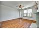 Well-lit living room boasts hardwood floors, a fireplace, and a door leading to the outdoors at 750 Waterscape Ct, Rock Hill, SC 29730