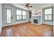 Bright living room with hardwood floors, fireplace, and plenty of natural light from large windows at 750 Waterscape Ct, Rock Hill, SC 29730