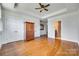 Spacious bedroom with hardwood floors, tray ceiling, and ample closet space at 750 Waterscape Ct, Rock Hill, SC 29730