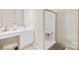 Clean, bright bathroom featuring a vanity area, shower, and neutral color palette at 763 Evans Manor Dr, Weddington, NC 28104