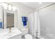 Neutral bathroom features modern fixtures, a shower-tub combo, and easy access to the adjacent room at 763 Evans Manor Dr, Weddington, NC 28104