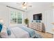Inviting bedroom featuring natural light, neutral tones, and stylish decor elements at 763 Evans Manor Dr, Weddington, NC 28104