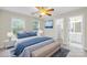 Calming bedroom features two windows, light-colored furnishings and an en suite bathroom with a walk-in closet at 763 Evans Manor Dr, Weddington, NC 28104