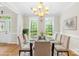 Dining room boasts bright lighting, large windows, and ample seating for Gathering and friends at 763 Evans Manor Dr, Weddington, NC 28104