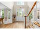 Grand foyer with high ceilings, hardwood floors, and a staircase, creating an elegant entrance at 763 Evans Manor Dr, Weddington, NC 28104