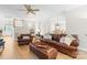 Cozy living room featuring hardwood floors and a comfortable leather sofa set at 763 Evans Manor Dr, Weddington, NC 28104