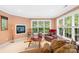 Comfortable sitting room area with fireplace, large windows, and stylish decor at 763 Evans Manor Dr, Weddington, NC 28104