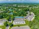 An aerial view features a residential community with lush greenery, a pond and a nearby swimming pool at 841 Lacebark Dr, Rock Hill, SC 29732