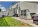 Spacious backyard featuring a patio, seating, lawn, and privacy fence, ideal for relaxing and entertaining at 841 Lacebark Dr, Rock Hill, SC 29732