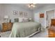 Cozy bedroom with neutral walls, carpet floors, ceiling fan, and ensuite bathroom at 841 Lacebark Dr, Rock Hill, SC 29732