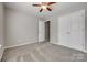 Neutral bedroom with a ceiling fan, and closet space offering functionality and comfort at 841 Lacebark Dr, Rock Hill, SC 29732