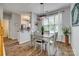 Dining area with wood floors, modern light fixture, and natural light at 841 Lacebark Dr, Rock Hill, SC 29732
