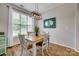 Bright dining area featuring hardwood floors, contemporary lighting, and a large window at 841 Lacebark Dr, Rock Hill, SC 29732