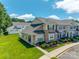 Townhome showcasing stone accents, manicured landscaping, and a freshly cut lawn at 841 Lacebark Dr, Rock Hill, SC 29732