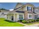 Charming townhome with stone accents, a well-manicured lawn, and a welcoming front porch at 841 Lacebark Dr, Rock Hill, SC 29732