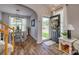 Inviting home foyer with hardwood floors and an open view into the dining area and staircase at 841 Lacebark Dr, Rock Hill, SC 29732