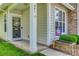 A close up of the townhome's charming front door with a decorative wreath and welcoming decorations at 841 Lacebark Dr, Rock Hill, SC 29732