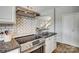 Kitchen with stainless steel appliances, granite counters, and white herringbone backsplash at 841 Lacebark Dr, Rock Hill, SC 29732