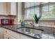 The kitchen has a stainless sink with granite counters and a subway tile backsplash at 841 Lacebark Dr, Rock Hill, SC 29732