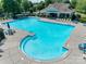 Large community pool with ample lounge chairs and seating, perfect for relaxation and socializing at 841 Lacebark Dr, Rock Hill, SC 29732