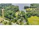 Aerial view of lakefront homes surrounded by mature trees at 8506 Graham Rd, Denver, NC 28037