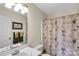 Well-maintained bathroom with a shower/tub combo and neutral decor at 8506 Graham Rd, Denver, NC 28037