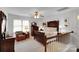 Bedroom featuring a wooden bed, decorative furniture, a ceiling fan, and lots of natural light at 8506 Graham Rd, Denver, NC 28037