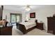 Bedroom features a sliding glass door leading to the outside and neutral decor at 8506 Graham Rd, Denver, NC 28037