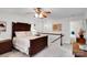 Bedroom boasts a decorative wooden bed, complemented by a ceiling fan and serene natural light at 8506 Graham Rd, Denver, NC 28037