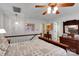 Bright bedroom with wooden furniture, ceiling fan, and decor that brings a homey feeling at 8506 Graham Rd, Denver, NC 28037