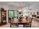 Open dining room offering view of living area and back patio through sliding glass door at 8506 Graham Rd, Denver, NC 28037