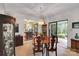Dining room area with sliding glass door to back patio and open view of kitchen at 8506 Graham Rd, Denver, NC 28037