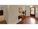 Foyer features hardwood floors, neutral walls, and a small table with flower arrangement at 8506 Graham Rd, Denver, NC 28037