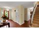Foyer with hardwood floors, staircase, and entry to other rooms in the home at 8506 Graham Rd, Denver, NC 28037