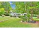 Charming single-story home with lush front yard, well maintained landscaping, and sidewalk at 8506 Graham Rd, Denver, NC 28037
