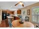 Eat-in kitchen features wood cabinets, stainless steel appliances, and a ceiling fan at 8506 Graham Rd, Denver, NC 28037