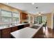 Well lit kitchen featuring an island with cooktop and view of eat-in dining area at 8506 Graham Rd, Denver, NC 28037
