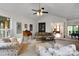 Open living room featuring neutral tones, a vaulted ceiling, and lots of sunlight at 8506 Graham Rd, Denver, NC 28037
