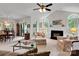 Cozy living area showcasing fireplace, vaulted ceiling, and access to the dining room at 8506 Graham Rd, Denver, NC 28037