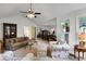 Open concept living room with ceiling fan flowing into the dining room at 8506 Graham Rd, Denver, NC 28037