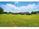 Expansive backyard with lush green grass, perfect for outdoor activities and gatherings at 924 Secrest Hill Dr, Monroe, NC 28110