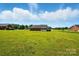 Spacious backyard featuring a well-maintained lawn and a charming home exterior at 924 Secrest Hill Dr, Monroe, NC 28110