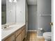 Well-lit bathroom with a single sink vanity and shower at 924 Secrest Hill Dr, Monroe, NC 28110