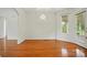 Bright dining area with warm hardwood floors and a view of the lovely backyard at 924 Secrest Hill Dr, Monroe, NC 28110