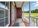 Covered front porch of a brick home, featuring a stylish welcome mat at 924 Secrest Hill Dr, Monroe, NC 28110