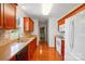 Well-lit kitchen with cherry wood cabinets, tile backsplash, and stainless appliances at 924 Secrest Hill Dr, Monroe, NC 28110