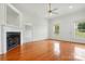 Spacious living room with hardwood floors, a fireplace, and plenty of natural light at 924 Secrest Hill Dr, Monroe, NC 28110