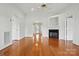 Bright living room features hardwood floors, a fireplace, and neutral wall paint at 924 Secrest Hill Dr, Monroe, NC 28110