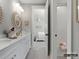 Bright bathroom with a double sink vanity, framed mirrors, and a bathtub with a shower at 1001 Kingbird Ln # 15, Clover, SC 29710