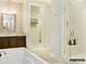 Bathroom featuring a soaking tub, glass shower, and modern vanity with ample counter space at 1001 Kingbird Ln # 15, Clover, SC 29710